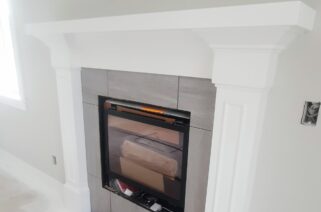 custom white elegant detailed fireplace mantle