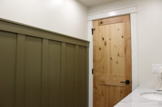 custom board and batten wall, custom millwork, custom trim, solid wood door