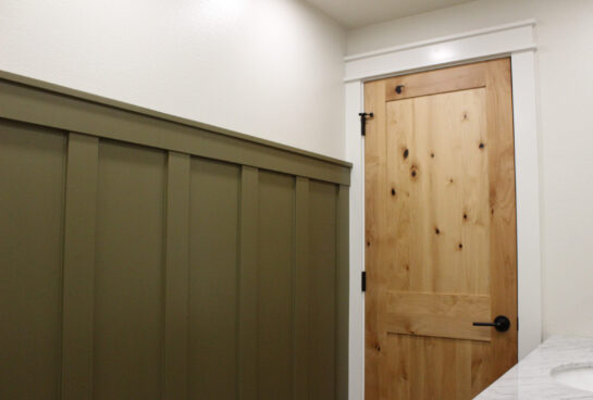 custom board and batten wall, custom millwork, custom trim, solid wood door